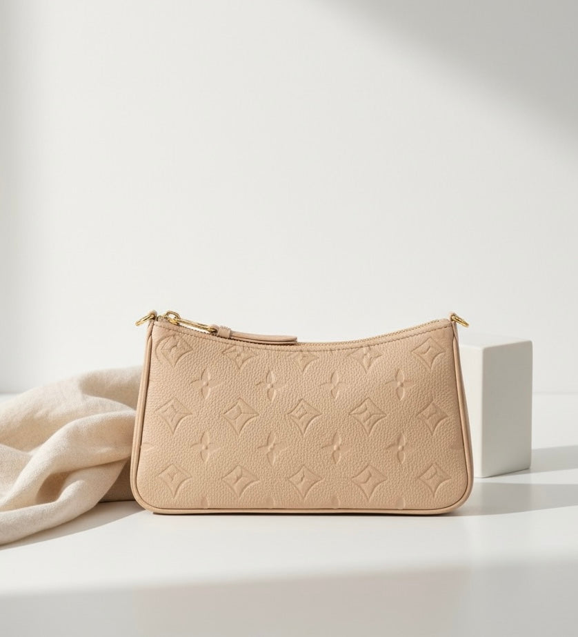The Embossed Pochette Designer Bag